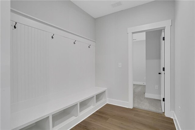 mudroom with hardwood / wood-style floors