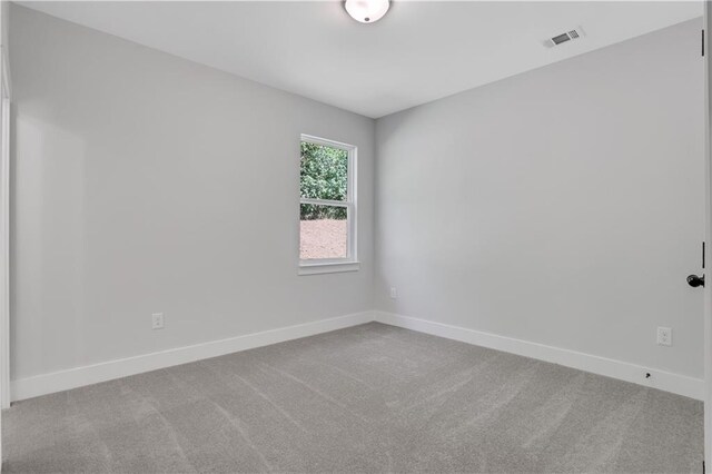 empty room featuring carpet floors