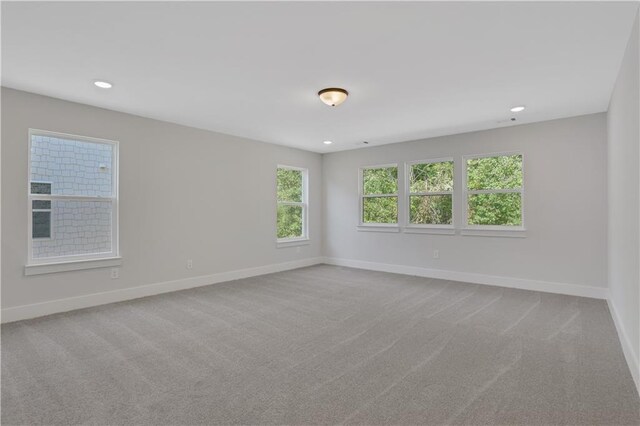 unfurnished room featuring carpet flooring