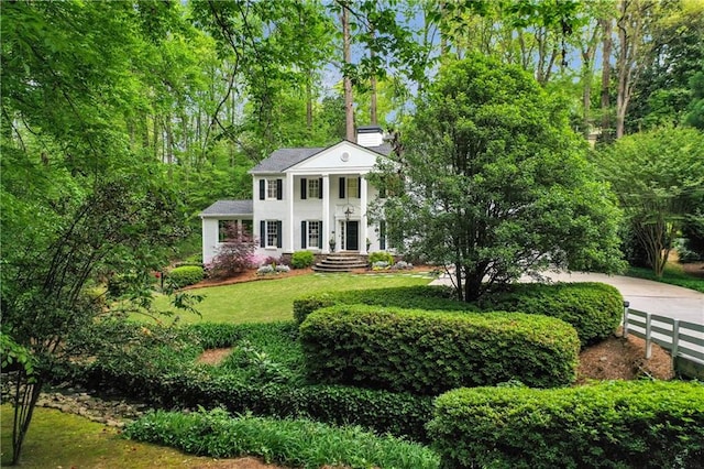 2562 Red Valley Rd, Atlanta, GA 30305 - neoclassical / greek revival house featuring a front yard, fence, and a chimney