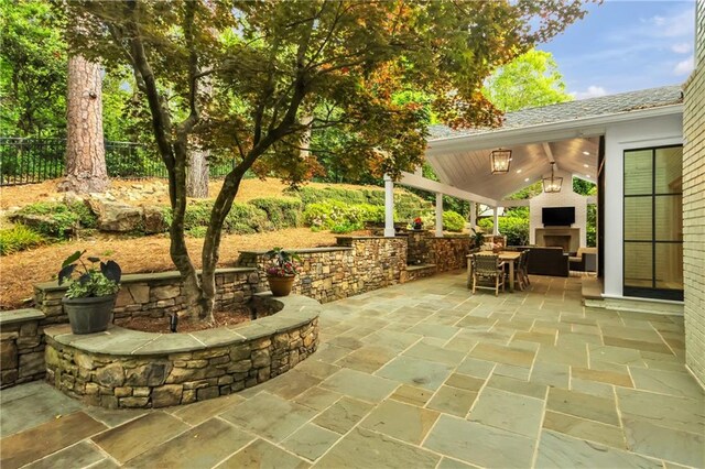 2562 Red Valley Rd, Atlanta, GA 30305 - view of patio with fence and an outdoor fireplace
