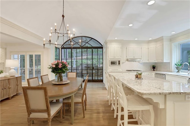 2562 Red Valley Rd, Atlanta, GA 30305 - dining space with light wood-style flooring, recessed lighting, a notable chandelier, and a healthy amount of sunlight