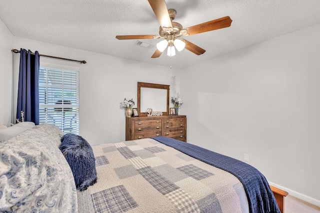 835 Custom Ln, Winder, GA 30680 - bedroom with a textured ceiling and a ceiling fan