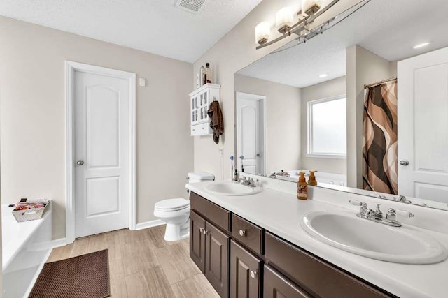 835 Custom Ln, Winder, GA 30680 - full bath with double vanity, a tub, toilet, baseboards, and a shower with curtain