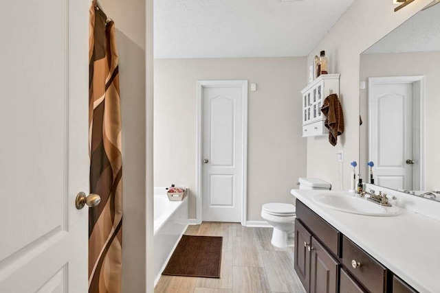 835 Custom Ln, Winder, GA 30680 - full bath with a garden tub, toilet, vanity, and baseboards