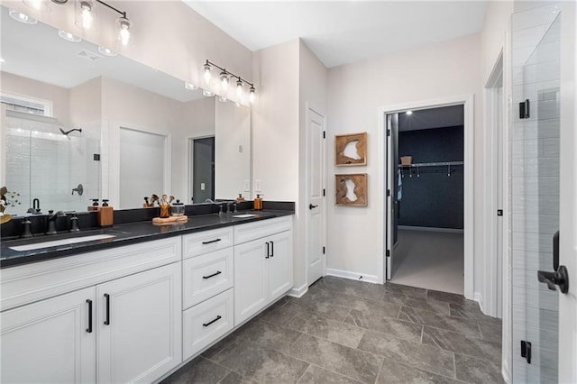 bathroom with an enclosed shower and vanity