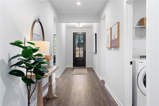 interior space with dark hardwood / wood-style floors and washer / dryer