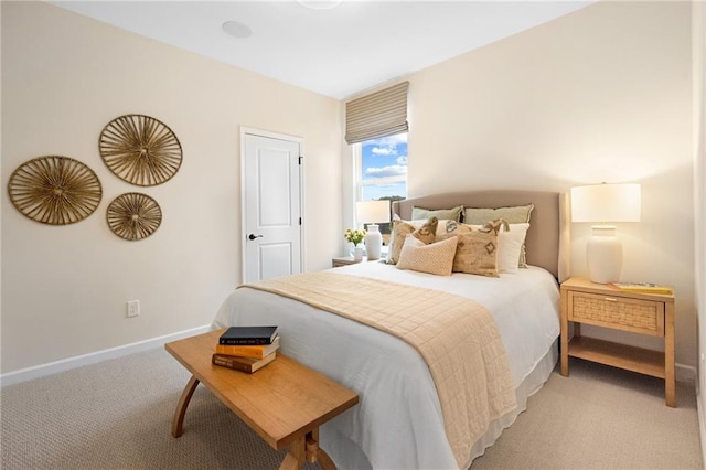 bedroom featuring light carpet