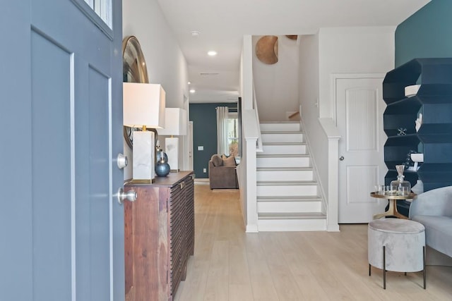 entryway with light hardwood / wood-style flooring