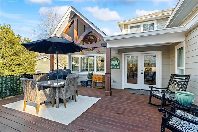 wooden deck featuring grilling area and french doors