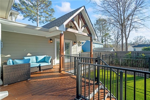 wooden deck featuring a yard and an outdoor hangout area