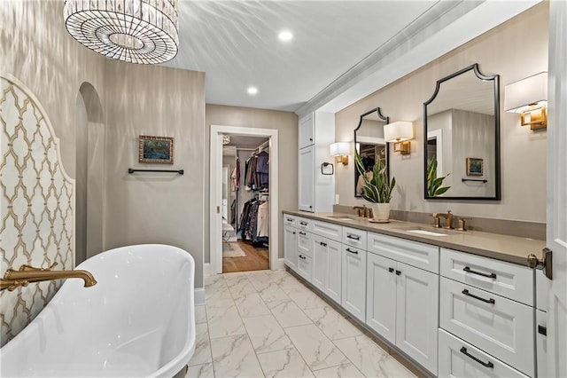 bathroom featuring vanity and a bathing tub