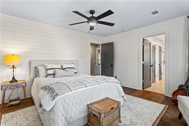 bedroom featuring hardwood / wood-style flooring and ceiling fan