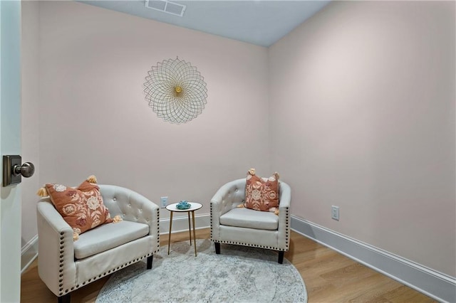 sitting room featuring hardwood / wood-style flooring