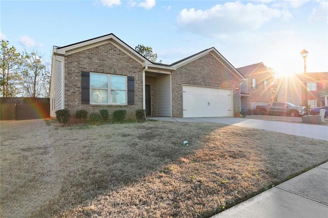 view of front of property with a front yard and a garage