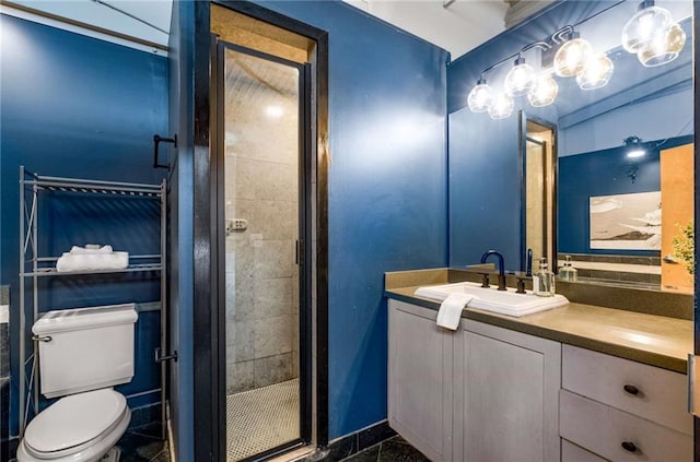 bathroom featuring vanity, a shower stall, and toilet