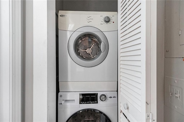 washroom with stacked washer / drying machine