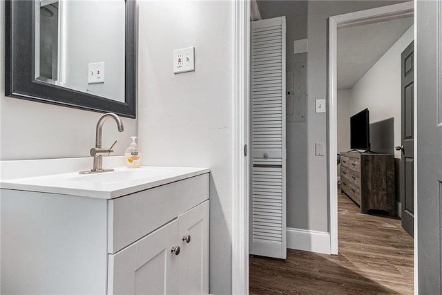 bathroom featuring hardwood / wood-style floors and vanity