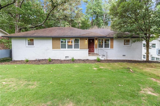 ranch-style house featuring a front lawn