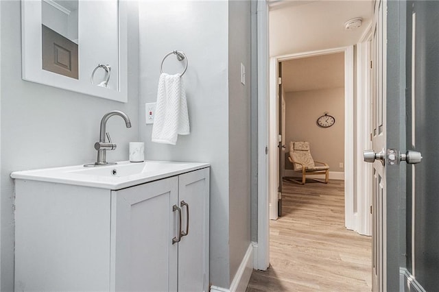 bathroom featuring hardwood / wood-style flooring and vanity