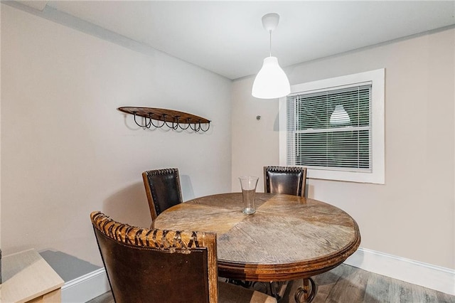 dining area featuring wood-type flooring