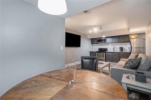 dining space with sink