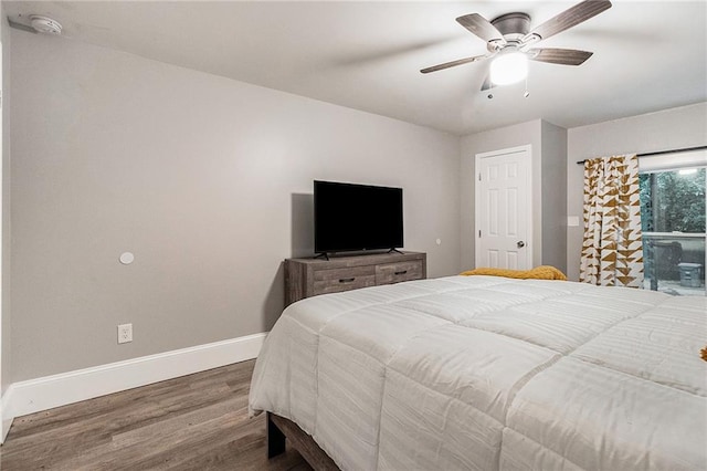 bedroom with hardwood / wood-style floors and ceiling fan