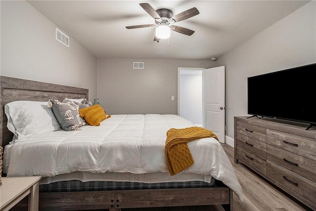 bedroom with light wood-type flooring and ceiling fan