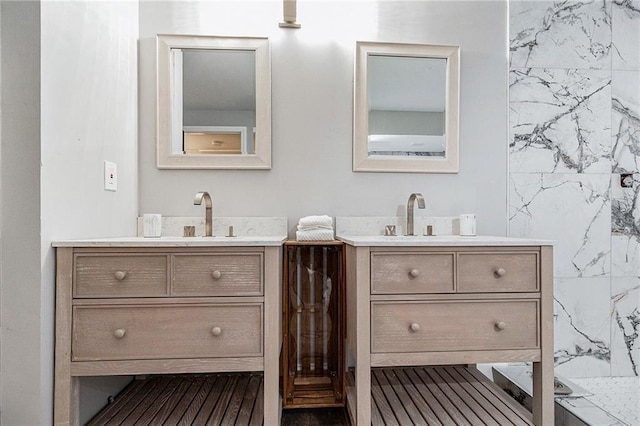 bathroom featuring vanity and a shower