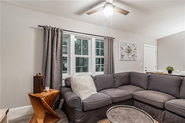 living room featuring hardwood / wood-style flooring and ceiling fan