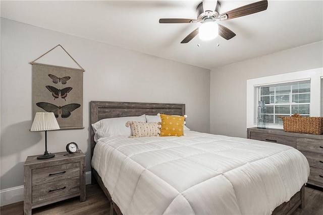 bedroom featuring dark hardwood / wood-style floors and ceiling fan