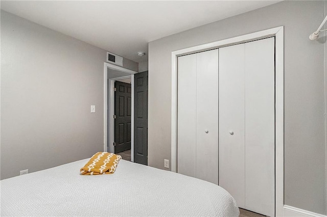 bedroom featuring a closet and wood-type flooring