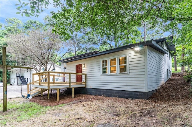 exterior space with a wooden deck