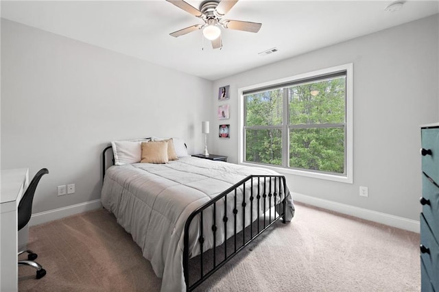 bedroom featuring baseboards, a ceiling fan, carpet floors, and visible vents