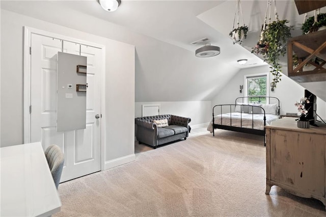 bedroom with carpet floors, baseboards, lofted ceiling, and visible vents