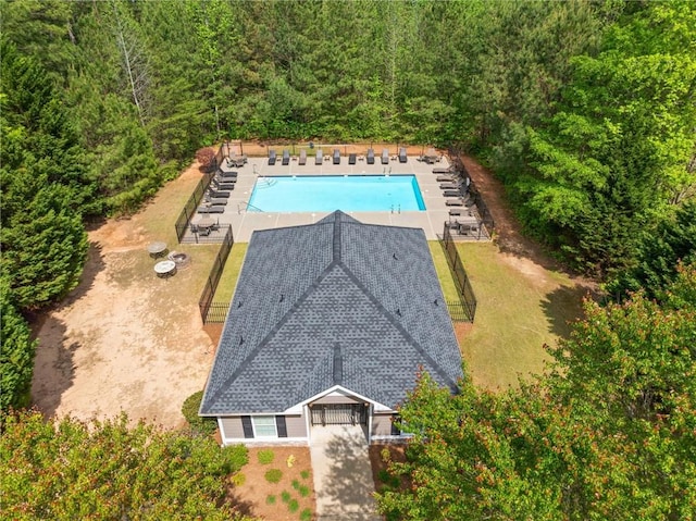 drone / aerial view featuring a forest view