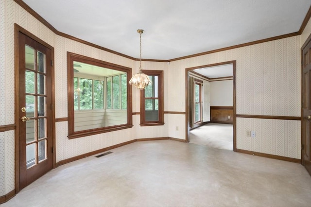 unfurnished room featuring tile patterned floors, wallpapered walls, ornamental molding, a chandelier, and baseboards