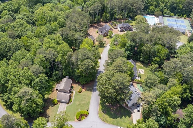 aerial overview of property's location featuring a heavily wooded area