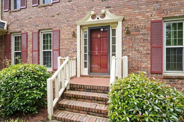 property entrance with brick siding