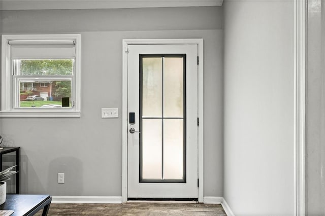 doorway with hardwood / wood-style flooring