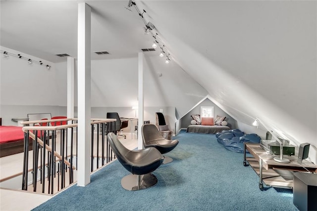 living area with carpet flooring and vaulted ceiling