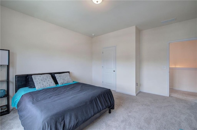 bedroom with light carpet