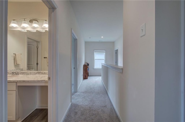 hallway with light colored carpet