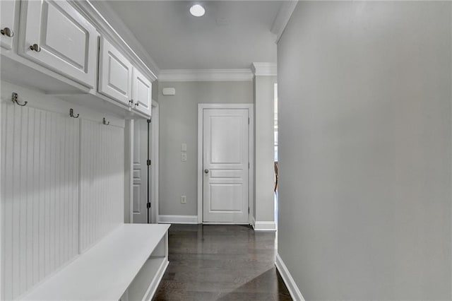 mudroom featuring baseboards, ornamental molding, and dark wood-style flooring