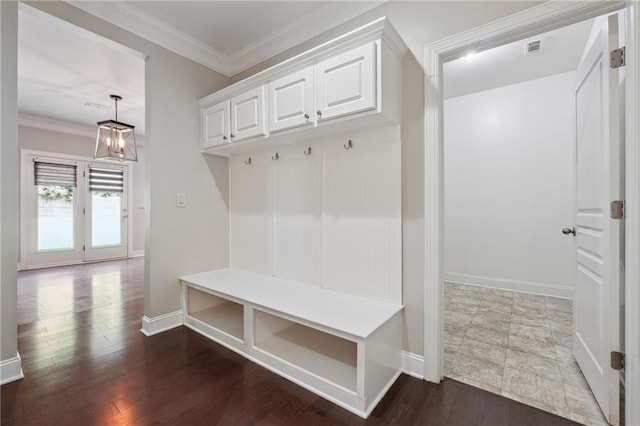 mudroom with visible vents, baseboards, dark wood-style floors, and crown molding