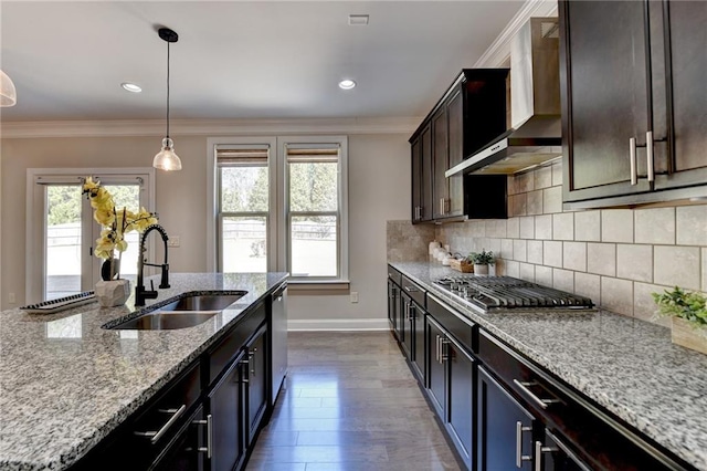 kitchen featuring decorative backsplash, ornamental molding, stainless steel appliances, and a sink