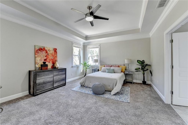 bedroom featuring visible vents, a raised ceiling, and ornamental molding