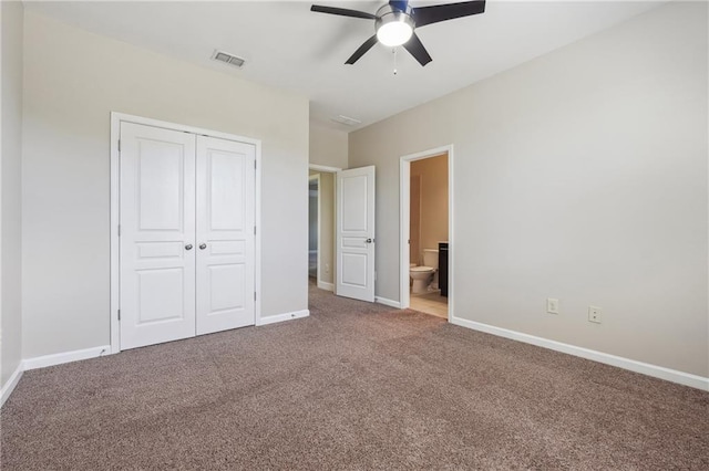 unfurnished bedroom with visible vents, baseboards, a closet, and carpet flooring