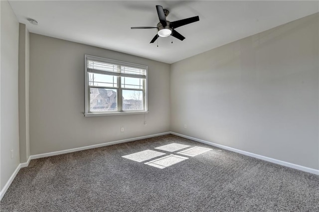 unfurnished room featuring carpet flooring, baseboards, and ceiling fan