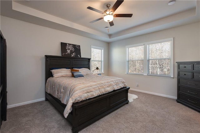 1076 Allspice Way, Lawrenceville, GA 30045 - carpeted bedroom featuring a tray ceiling and ceiling fan